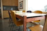 Barry also built the dining table, which seats eight. The top was made from figured maple; the legs are bubinga. Photo by Barry B. Doyle.