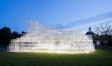 2013: Sou Fujimoto

Called a “cloud of steel,” Fujimoto’s gorgeous grid, assembled from 28 kilometers of white poles, is almost translucent. The barely visible roof, built from clear polycarbonate discs, ruffled in the breeze.

Photograph © 2013 Jim Stephenson