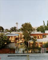 This solar-powered compound in Venice, California, was inspired by architect and resident David Hertz's surf safaris. As a young man traveling in Bali, he was impressed by tropical village compounds where indoors and out flow into each other. “Those houses seemed able to breathe, like plants and flowers,” he recalls.