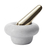 Tom Dixon's marble mortar and brass pestle with a cast iron core brings back the stone age, promising to cure impoverished senses by coaxing fresh herbs and spices to release their delicate flavors.