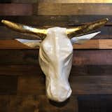 Bull Head in White Gold Leaf

A new piece that’s exclusive to A&G, these custom-made papier-mache heads provide a handmade touch and dramatic impact on a wall, and are light enough to hang with a single nail.  Photo 5 of 10 in Shops We Love: A&G Merch