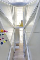 The five-foot wide Keret House was built in an alley in Warsaw, Poland. Working within such tight boundaries, architect Jakub Szczesny was forced to get creative with the design. The bedroom is accessed by ladder and the fridge has just enough room to fit two drinks. While the design might be too sparse for a full-time home, Szczensny’s intent was to create a temporary home for a rotating roster of artist tenants and to push the boundaries of small space living. Photo by Bartek Warzecha.