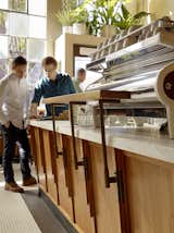 The bar counter is Cararra marble and the metalwork is by Hicks Metal.