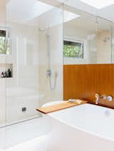 Bath Room and Freestanding Tub The master bath is a bright sanctuary with a freestanding tub by Victoria + Albert and Ecostat shower fixtures by Hansgrohe.  Search “8 renovated midcentury kitchens” from Wood Paneling Loses its Dated Reputation With This Renovation of a 1959 Portland Gem