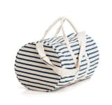 This heavyweight canvas duffel bag designed by Emily Sugihara for Baggu is a casual way to keep your essentials safe and secure. Suitable for weekend getaways and overhead bins, the Baggu Duffel Bag will quickly become your go-to travel bag.