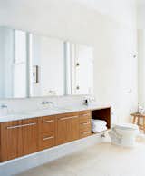 The master bathroom used to be a tiny kitchen in what was once a tiny apartment. The cabinets were designed by Nilus de Matran and fabricated by George Slack.