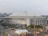 Houston Astrodome (Houston, Texas: 1965)

History: Though it carried the clunky, official title of the Harris County Domed Stadium when it opened, the Astrodome was quickly nicknamed the “Eighth Wonder of the World” (typical Texas-sized modesty). Former Houston Mayor Roy Hofheinz organized a winning bid to bring a baseball team to Houston on the condition they build a covered stadium to compensate for Texas summer temperatures; Hofheinz supposedly drew inspiration for the dome from the cloth “valeria” that covered the Roman Colosseum. Home to the Houston Astros until 2000, the Astrodome also hosted the first televised NCAA basketball game, the Battle of the Sexes tennis match between Billie Jean King and Bobby Riggs, and an Evel Knievel stunt jump (plans to jump the stadium fell through) before falling into disuse in the early 2000s.

Status:  After the Astrodome was named one of the National Trust's 11 Most Endangered Historic Places in 2013, the Harris County Sports and Convention Center, which runs the site, unveiled the New Dome Experience plan to turn the stadium into a multiuse facility (a forward-thinking plan with more support than previous ideas of turning the dome into a hotel or movie production studio). Houston voters rejected a bond referendum last fall that would have moved the plan forward.

What You Can Do: The building is currently in limbo; demolition isn’t slated yet, mostly because of the cost and potential environmental damage that would ensue. While it hasn’t been updated recently, the New Dome PAC

site hosts plans and photos of the dome’s past and (potential) future.

Image Credit: Bukowsky18, Creative Commons  Photo 3 of 9 in 8 Endangered Modern Structures