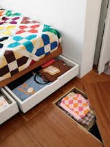 Begin by reviewing your space for any possible storage tricks. Thinking outside of the box allows you to find overlooked creative solutions, such as shallow rolling drawers under beds or floors—such as in this example. &nbsp;