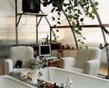 Boglione's terrarium-like bathroom doubles as an office. Every morning he sits in his armchair with his laptop before venturing further afield.  Photo 5 of 12 in Tips for a Clutter-Free Home Office by Erika Heet from Basic Living