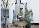 Each unit has its own outdoor space, but none are physically bounded, facilitating spontaneous interaction. Taeko Nakatsubo, an architect with the Office of Ryue Nishizawa, enjoys a quiet moment outside.