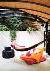 At one end of the space, which is topped by a barrel ceiling, a hammock offers a tantalizingly cozy place to nap.