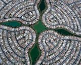 Reminiscent of a desert flower from above, this Arizona suburb is fixed around the landscaped greenery at its center. Photo by Christoph Gielen.  Photo 3 of 5 in Suburban Sprawl Photographed from Above