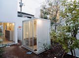 The evening bath is a ritual in Japan, and public baths are still around, but this is a new twist. Moriyama curtains the bath during use, but won’t cover any other windows, “because it feels good to couple the inner space with the outside world.”  Photo 6 of 7 in A Look at Open-Air Showers by Dwell from Modern Showers