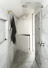 The Salvatori marble tiles in the bathroom were added at the last minute, once everyone was confident that they would not put the project over budget.