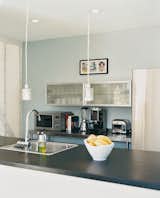 The Viking range and Bosch refrigerator in the kitchen are paired with Ikea lights and cabinets.
