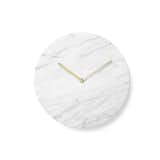 Refined and elegant, the Marble Wall Clock features simple, clean lines. Designed by Norm Architects, the clock is stripped of unnecessary details and focuses instead on the marble face and simple hands, which are crafted from lacquered brass.