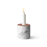The aptly named Chunk Candleholder from Menu is a solid, substantial piece that looks purposeful and strong when set on a shelf or table. The cylindrical marble slab features a copper top, which counters the organic, raw nature of the marble with sophisticated shine.