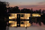 Di Vece Arquitectos, Capilla del Lago (2010) 

Working on a slightly smaller scale, this waterfront, open-air structure in Michoacán, Mexico, boasts supports that function like a cluster of votives at night.

Photo courtesy Di Vece Arquitectos