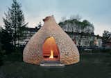 Haugen/Zohar's salvaged-wood Fireplace for Children, in Trondheim, Norway, serves as a sheltered place for storytelling. Photo by Haugen/Zohar Arkitekter/TASCHEN.