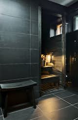 This in-home sauna has been built from alder, which has been stained black for a sleek modern finish.&nbsp;