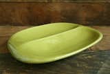 The American Modern collection for Bauer Pottery is made in California in a variety of colorways.  Shown, is the American Modern divided vegetable bowl in chartreuse.  Search “nothing is disposable dish towel” from Design Icon: Russel Wright