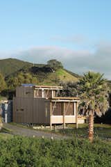 Designed for off-grid functionality out of necessity, the self-sufficient bach that Herbst Architects designed for their friend is a stellar getaway on New Zealand’s Great Barrier Island. Clad in cedar, the modestly sized abode embraces outdoor living and views of the Pacific Ocean.