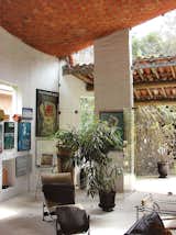 The living room of La Torraccia, a small guesthouse addition Bo Bardi designed in 1964 for the Cirell House in São Paulo, at once recalls vernacular architecture and the curvilinear forms of Spanish-Catalan architect Antoni Gaudí.  Photo 5 of 5 in Why Brazilian Modernist Lina Bo Bardi Is “Among the Most Important Architects of the 20th Century”