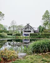 An installation by Dale Chihuly rests in the pond.  Photo 6 of 12 in Q&A with Textile Designer Jack Lenor Larsen
