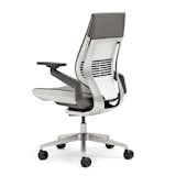 "You want to make sure that your feet aren't unsupported," Burn says. "If you do have the feet on the floor and your thighs aren’t parallel to the floor you could be compressing the circulation in the back of your leg. Adjusting the feet to the right height is crucial." Gesture chair by Steelcase Design Studio in collaboration with Glen Oliver Loew, $979.  Photo 4 of 5 in How to Shop for an Ergonomic Task Chair