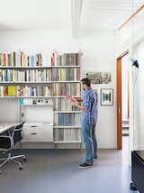 Office, Chair, and Shelves “It’s like Lego for grown-ups,” Fissmer says of Rams’s 606 Universal Shelving System for Vitsœ, which makes another appearance in the office. “It’s a responsible way to handle storage.”  Photos from A Midcentury Home Keeps the History Alive