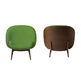 Hug armchair by Studio Jean-Marc Gady. Bumpy upholstery offsets the rigid oak structure.