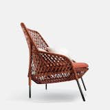 Ahnda chair by Stephen Burks for Dedon. Latticed red, orange, and brown textile cord make up the sides and back of the indoor-outdoor lounge chair.