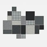 BuzziPatch by Sas Adriaenssens for BuzziSpace. Patchwork rug tiles that attach to one another with leather straps are available in four color sets.
