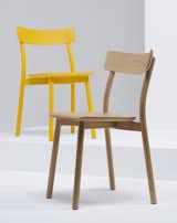 The chairs are available naturally finished in oak and in ash, as well as in white, gray, red, blue, yellow, and black stained ash.