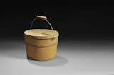 This lidded wooden pail was made in New Hampshire around 1855. One of only a few surviving Shaker pails, this example’s well-constructed, functional design is enhanced by a beautiful yellow painted lid. Photo courtesy Skinner, Inc.