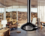 A view from the interior of the "iT House" , the home is more a watchtower for the desert scenery. The large expanses of operable sliding glass doors offer plenty of cross-ventilation and the cool concrete floors  provide ample thermal mass.&nbsp;