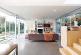 Michael Ferguson designed VillaCasa with large glass doors that pivot open from the living and dining areas to the terraced courtyards for an easygoing indoor-outdoor feeling. Photo by Joshua White Photography.