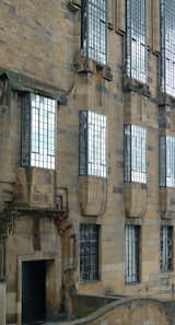 Mackintosh drew inspiration from Scottish castles and tower-houses for his Glasgow School of Art. The large, industrial windows offset this historical influence, giving the building an eclectic sensibility unique to Mackintosh. Photo courtesy Mackintosh Architecture, University of Glasgow.