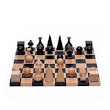 The seasonal change probably means more inside time, and we think there’s no better way to pass the time than to play a classic game with family members and friends. This chess set came out of a lifelong friendship with chess enthusiast friends Marcel Duchamp and Man Ray. Man Ray creates this distinctive chess set in 1920, offering a personal interpretation of each character on the chess board: an Egyptian pyramid for the King, a medieval headdress for the Queen, a flask for the Bishop and the carved scroll of a violin for the Knight.