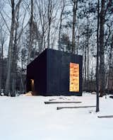 Jason and Suzanne Koxvold commissioned Studio Padron to design a 200-square-foot guesthouse on their Ellenville, New York, property. The geometric structure’s dark cedar cladding contrasts with the inviting interior, which is heated by a cast iron Jøtul stove. A layer of built-in bookshelves made from felled oak lumber also helps insulate the building in winter. While not distinctly designed for a grandma, the minimalist exterior and warm interior filled with books is certainly an inspirational example.