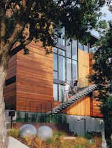 An existing home in San Francisco was renovated by architect George Bradley as his home with Eddie Baba, an attorney. The house was reconfigured to accommodate the entrance on the second floor, but the couple retained the in-law unit as a rental but shrunk it from two floors to one, creating space in which to carve out an office and a guest bedroom on the bottom floor of the main house.