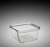 "When Pyrex was launched in 1915 as clear glass ovenware, American consumers needed to be persuaded that baking in glass was not only feasible, but provided benefits that baking in metal, iron, and earthenware did not have," Brumagen says. "To aid them in their campaign, Corning Glass Works executives turned to leading home economists to first test the new material in the kitchen and then to promote it to Americans through advertising, cooking columns in magazines, and demonstrations."

Pyrex Utility Baking Dish, made by Corning Glass Works, 1915-1925.  Photo 1 of 9 in Classic Cookware a Staple in American Kitchens for 100 Years by Allie Weiss