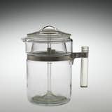"Despite its initial success, Pyrex sales began slowing down in the 1920s. Pyrex was a borosilicate glass, expensive to manufacture due to its higher melting temperatures, and, as a result, priced more as a luxury purchase, not easily affordable by the masses. It wasn’t until Corning developed an automated production process in the 1930s that prices on Pyrex dropped and sales were able to rebound."

Pyrex Flameware Six-Cup Percolator, made by Corning Glass Works, 1939-1951.