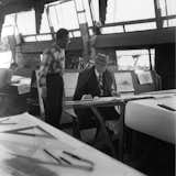 Frank Lloyd Wright at a drafting table&nbsp;