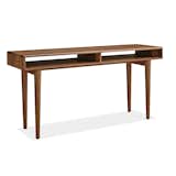 Grove Desk for Room & Board. Handcrafted by Pennsylvanian woodworkers, the Grove desk features a natural oil-and-wax finish that showcases the grain of its solid wood construction. Mid-century details like turned tapered legs and beveled edges lend an air of refinement.