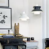 The Doo Wop Suspension Light, originally called the Navy Light, was first designed in the 1950s in collaboration with the Navy Buildings Department. Although this pendant light is a modern take on the classic, the Doo Wop Pendant uses the same production methods as in the 50s, including hand-spun shades that are completed with a fine rolled edge.  Photo 1 of 6 in Classic Lights from Louis Poulsen by Marianne Colahan