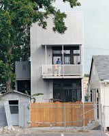 Resident Tony Vanky gets the second-story deck prepared for guests. The grittiness of the Black Pearl neighborhood is plainly visible.  Photo 10 of 11 in New Orleans, LA
