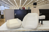 The seatmaker sculpts a form out out of the foam. The more dense foam offers rigid support while the less dense sections conform more to a driver's body.