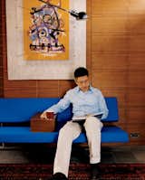 Langston-Jones created a custom armrest that he had made to fit snugly on his blue Slaapbank sofa designed by Martin Vissin.  Photo 7 of 9 in Twice as Nice