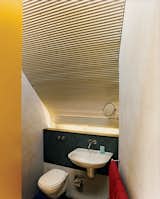 Tight quarters in the bathroom allow for a bit more room in the main living spaces.